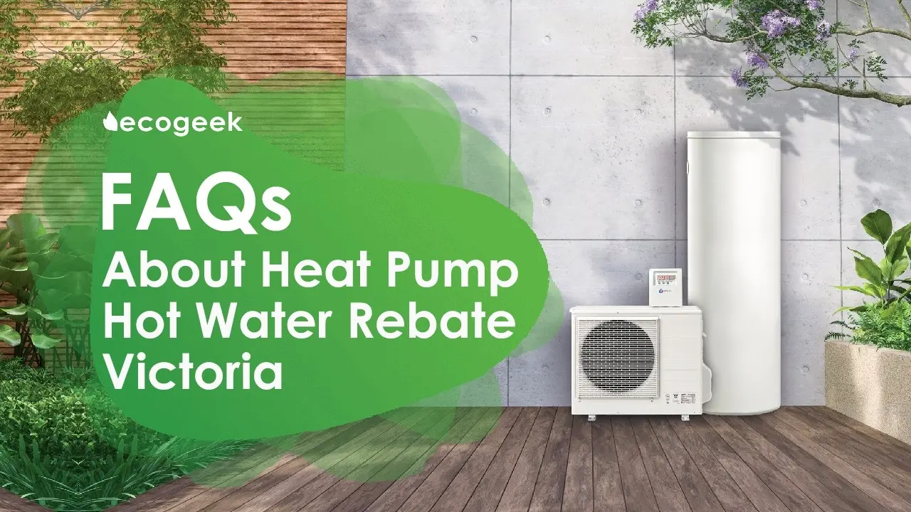 Outdoor scene featuring a heat pump unit and cylindrical hot water tank against a concrete wall, surrounded by greenery and timber decking. Text overlay reads “FAQs About Heat Pump Hot Water Rebate – Victoria,” with EcoGeek branding.